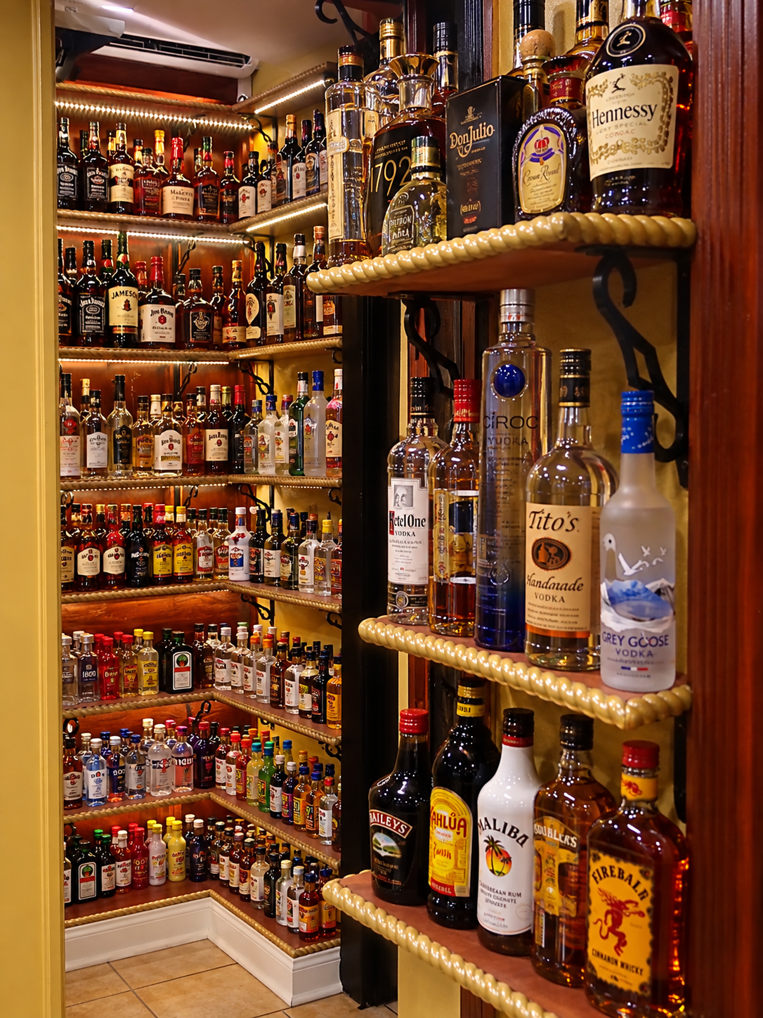 Premium spirits display with Hennessy, Don Julio, and more
